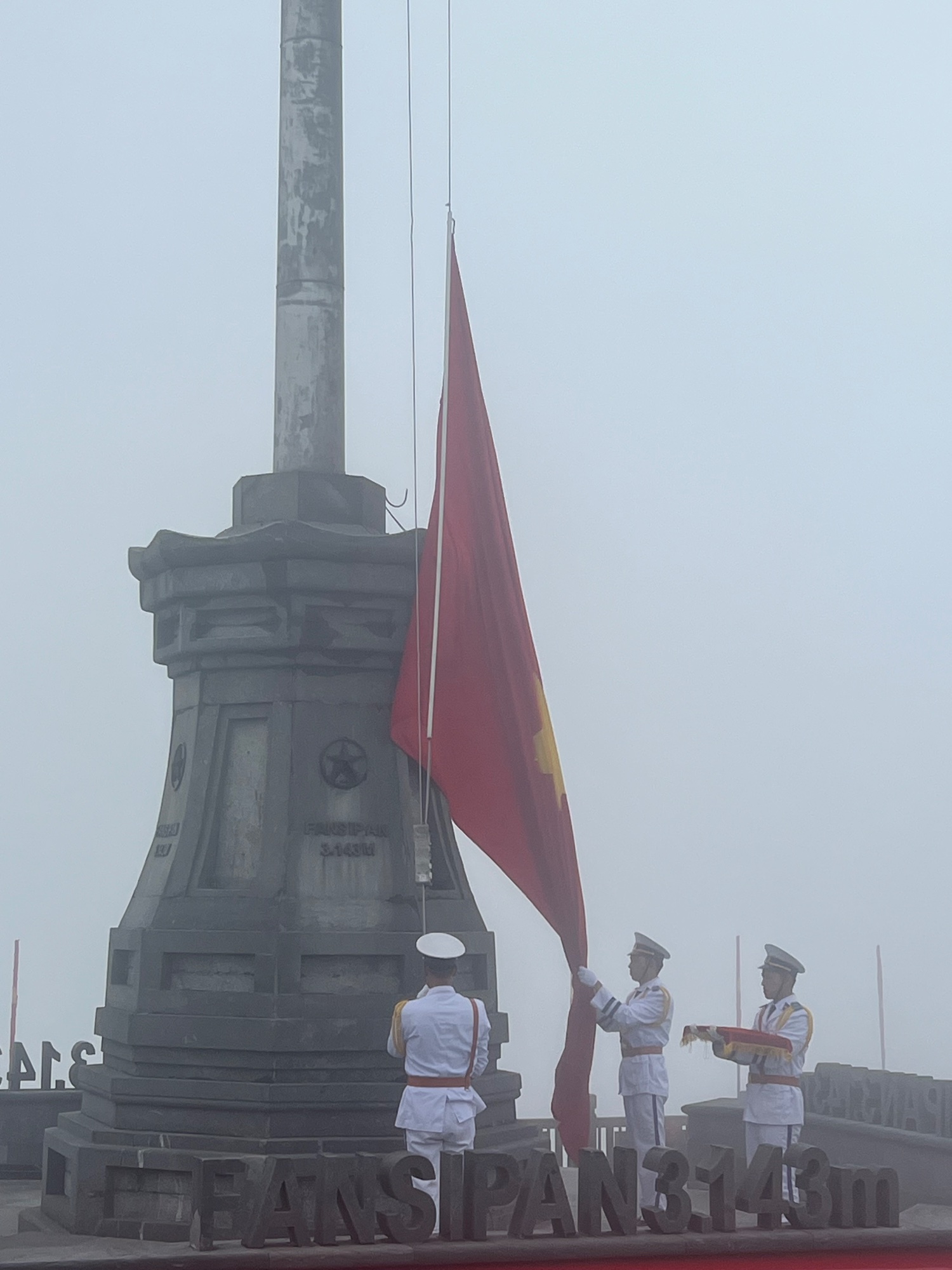 Raising the flag.