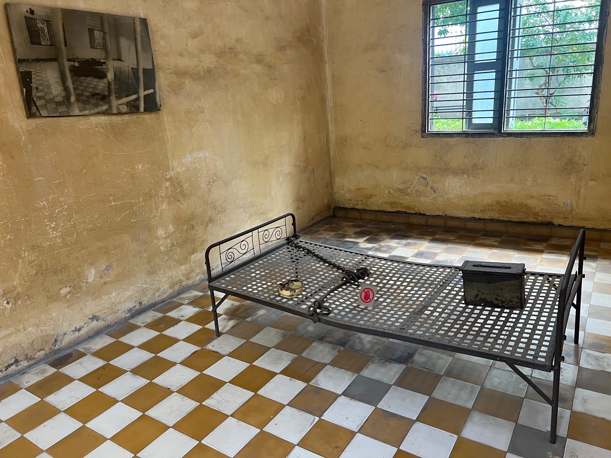 Prisoners were chained to a bed, were they were tortured till they "confessed". One torture was electrocution.  While rest of the country was intentionally weaned of electricity, S 21 had it own power generator. 