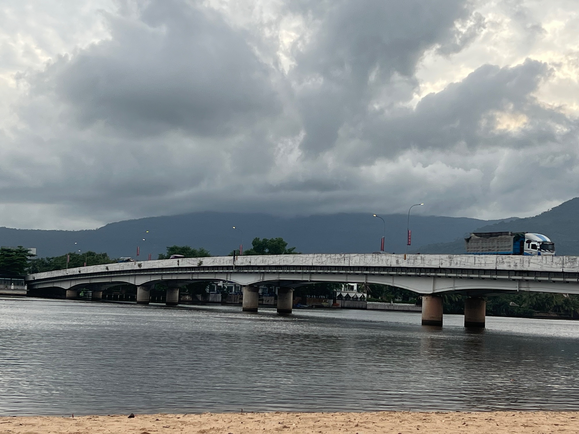 Back in Kampot looking back up to Mt. Bokor still engulfed in grey.